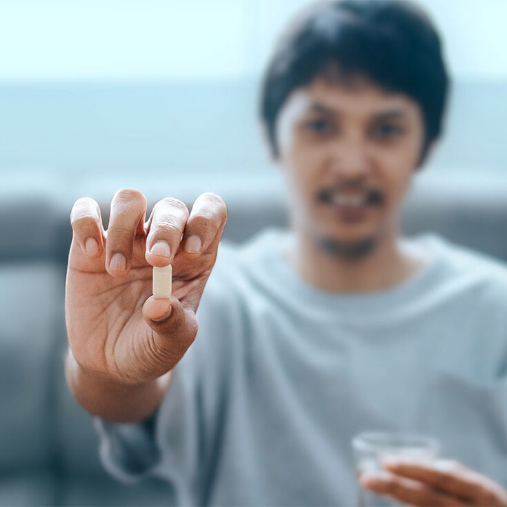 male-showing-a-pill