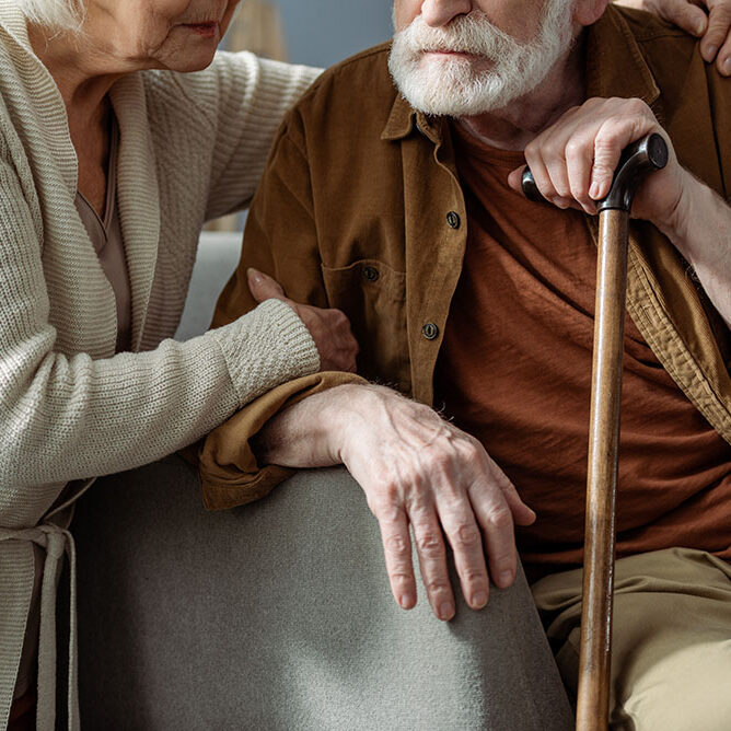 cropped-view-of-senior-woman-hugging-husband